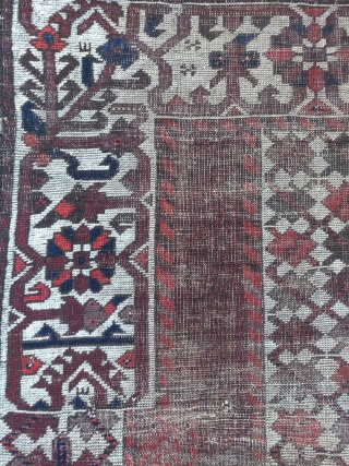 Baluch 'crypto prayer rug'? with a dramatic border break at the top and blue and white silk knots punctuating a line about a quarter up from the bottom. Worn with weft showing  ...