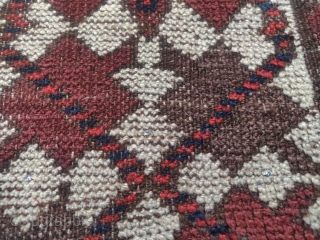 Baluch 'crypto prayer rug'? with a dramatic border break at the top and blue and white silk knots punctuating a line about a quarter up from the bottom. Worn with weft showing  ...