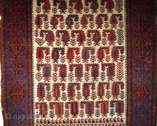 Baluch white-ground rug with scorpion-like botehs and smaller botehs                        