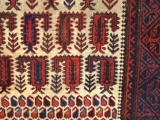 Baluch white-ground rug with scorpion-like botehs and smaller botehs                        