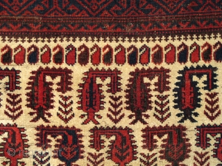 Baluch white-ground rug with scorpion-like botehs and smaller botehs                        