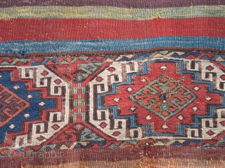 Colorful and very old fragment of a flat-woven East Anatolian chuval with well-drawn Memling guls and kilim stripes.               