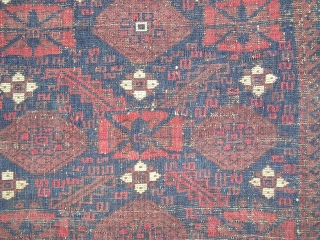 Baluch minakhani bagface ( khorjin fragment ) with saturated color and interesting features for the structurally inclined including alternating bands of Turkish and Persian knots and a pronounced pattern of weft shifts  ...