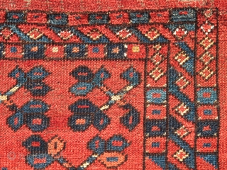 Ersari Trapping, great vibrant madder red. The top row of ornament is drawn on a smaller scale while the bottom is larger-scale spaced more openly. This contrast in composition is further highlighted  ...