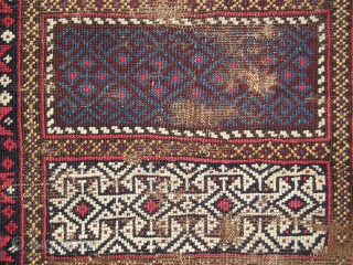 Enigmatic Baluch weaving. Probably a Poshti but perhaps some other sort of bag or bridge. It is symmetrically knotted  using a design repertoire  more commonly seen in flat-woven pieces. The  ...