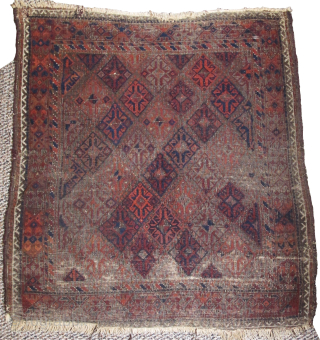 Square-shaped Baluch rug with a repeat diamond latch-hook design. All good color with a subtle but effective use of to tone. Thick patches of indigo dyed pile contrasting with corroded brown and ...