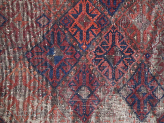 Square-shaped Baluch rug with a repeat diamond latch-hook design. All good color with a subtle but effective use of to tone. Thick patches of indigo dyed pile contrasting with corroded brown and ...