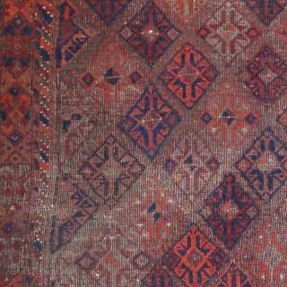 Square-shaped Baluch rug with a repeat diamond latch-hook design. All good color with a subtle but effective use of to tone. Thick patches of indigo dyed pile contrasting with corroded brown and ...