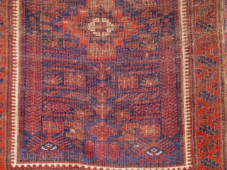 Double Tree 19th Khorosan Baluch. Perhaps based on reduction and adaptation of earlier garden carpet design. Central medallion with zig-zag kilim, all good colors with poly-chromatic blues. Small stain in medallion. I  ...