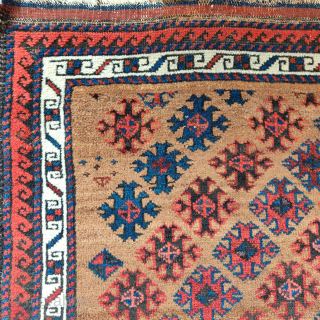 Small camel ground Baluch rug with floating diagonal elements excellently spaced, rustic construction with camel, wool and brindled warp, striped kilim on both ends. distinct band if abrash towards the bottom of  ...