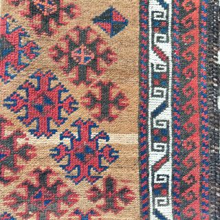 Small camel ground Baluch rug with floating diagonal elements excellently spaced, rustic construction with camel, wool and brindled warp, striped kilim on both ends. distinct band if abrash towards the bottom of  ...