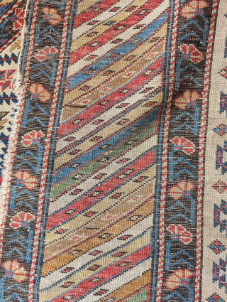 Squarish Caucasian Kuba rug with large diagonally striped border and ivory field with shrubs, loss to sides, Rather charming, 3'5"x4'0"             