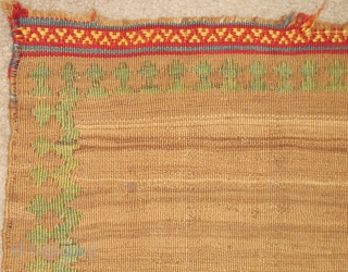 Miniature Minimalist South Persian Kilim with a natural abrashed camel ground and pistachio green border. Perhaps a small sofreh, cover or bread cloth. There are remains of knotted warps on either end  ...