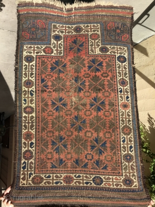 A highly unusual red ground Baluch prayer rug, Symmetrical knotted. 
3’.3” x 2’.6” Circa 1880
Highly depressed wraps. All vegetable dyes. 
Original side finish with goat hair. 
Woven upside down. 
Not washed or  ...