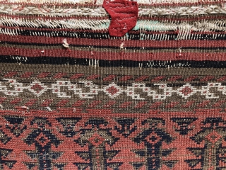 Rare red ground, Baluch, 19th century. 4’.5” x 2’.9”
Original condition not washed or repaired.
One tiny piece of felt sewn behind the killim end as shown in photo.
AS: to the left   