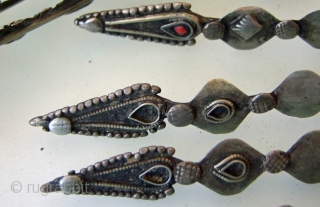 Pashtun Head Ornament, was worn either on the head or as a necklace.
Each of the 14 pieces is 19cm long and is made from metal with a low silver content.Afghan/Pakistan Border Region.  ...