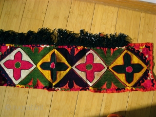Uzbek Suzani border fragment.  55 inches long, 7 inches wide.  Pieced and sewn, 4 inches, 12, 10 and 30 inches. Fringe 2 inches.  Tight bright embroidery.    