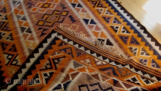 Afghan kilim, purchased in Peshawar 1989.  64 inches by 109 inches.  Fringe worn, one inch square raveling spot.  Bright orange, cream and dark blue-black.  All wool.  Age  ...