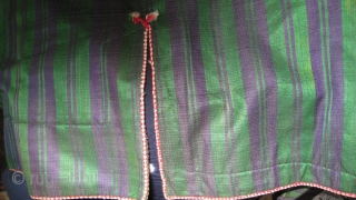 Afghan man's coat choghah.  Classic blue and green stripe silk outside, cotton print inside.  Corduroy lining edge, red and white cotton braid decoration.  Sleeve ends embroidered with blue/black stitching.  ...