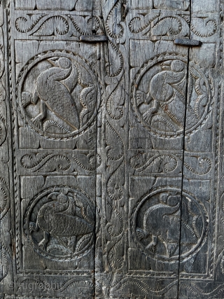 The mud-covered walls of their huts are adorned with plain floral or animal motifs. In their villages wooden pillars stand with totemic or commemorative functions, and massive wooden doors protect the more  ...
