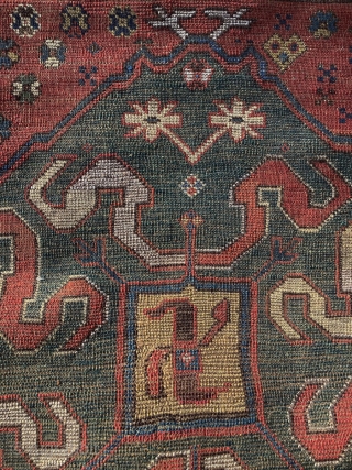 Chondzoresk. "Cloudband" Karabagh Long Rug, second half 19th century, 11ft x 4ft 2in.  This long rug features 3 beautifully drawn medallions on a red ground. The central ivory medallion provides graphic  ...