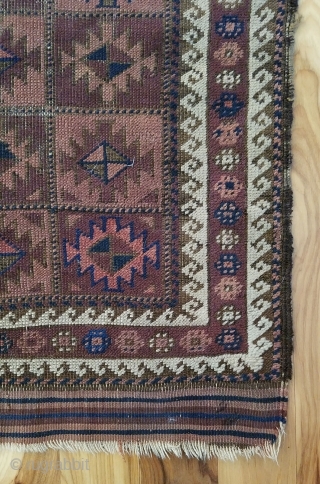 Baluch Rug. Unusual and very nicely balanced palette, with multiple shades each of blue, red and purple. 54" x 28". The design and the color would indicate an Aimaq origin. Evenly worn  ...