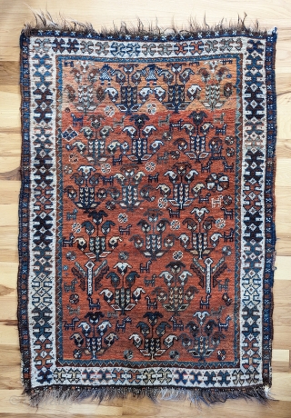 Luri small rug. 36" x 48".  Rustic, very improvisational field filled with floral and animal forms on a copper ground. Even wear to center, end losses.  Good little decorative piece  ...