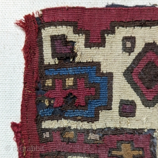 Pre-Columbian Textile Fragment.  Huari Culture, c. 500-800 A.D.  A small fragment, probably a remnant from a burial mantle.  The creature most likely depicts a jaguar, a common pre-Columbian weaving  ...