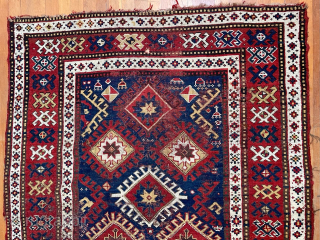 Caucasian Kazak rug, late 19th C.  Generous size--54 inches wide by 86 inches long (4 feet 6 in. x 7 feet 2 in, or 135 cm x 219 cm).  Blue-ground  ...