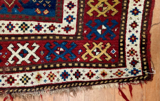 Caucasian Kazak rug, late 19th C.  Generous size--54 inches wide by 86 inches long (4 feet 6 in. x 7 feet 2 in, or 135 cm x 219 cm).  Blue-ground  ...
