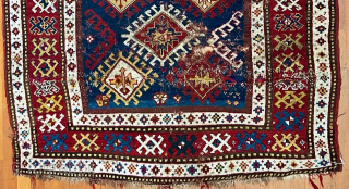 Caucasian Kazak rug, late 19th C.  Generous size--54 inches wide by 86 inches long (4 feet 6 in. x 7 feet 2 in, or 135 cm x 219 cm).  Blue-ground  ...
