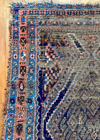 A very old Kurdish carpet, used too long on the floor, but potentially restorable. 76 inches x 52 inches (at widest), or 193 cm x 132 cm.  Pile ranging from good  ...