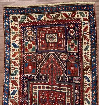 Eastern or southeastern Caucasus.  118” x 43” (301 cm x 1090 cm).  Older runner (mid 19th ?), with unusual design of large 3-lobed medallions.  Lots of other filler elements,  ...