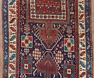 Eastern or southeastern Caucasus.  118” x 43” (301 cm x 1090 cm).  Older runner (mid 19th ?), with unusual design of large 3-lobed medallions.  Lots of other filler elements,  ...