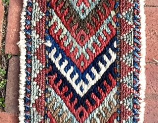 A colorful fragment with bold graphics that I identify as the bridge (the connecting section between the two bags) of a large khorjin, most likely Jaff Kurd. Its size is appropriate--it is  ...