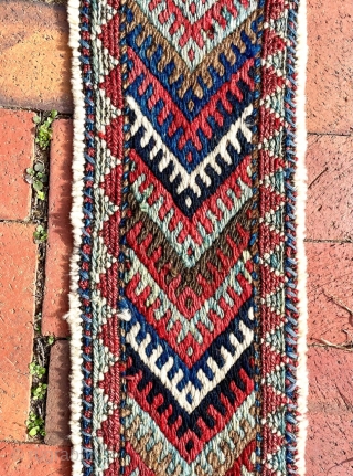 A colorful fragment with bold graphics that I identify as the bridge (the connecting section between the two bags) of a large khorjin, most likely Jaff Kurd. Its size is appropriate--it is  ...