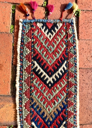 A colorful fragment with bold graphics that I identify as the bridge (the connecting section between the two bags) of a large khorjin, most likely Jaff Kurd. Its size is appropriate--it is  ...