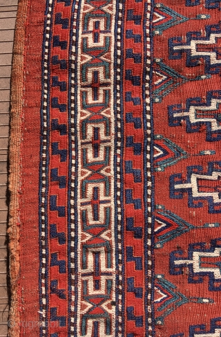 Yomut chuval, complete with red plainweave back. Flatweave with Memling-gul design in sumac and other weft-wrapping.  49” wide by 30” deep (125 cm x 76 cm).  Overall condition very good.  ...