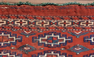 Yomut chuval, complete with red plainweave back. Flatweave with Memling-gul design in sumac and other weft-wrapping.  49” wide by 30” deep (125 cm x 76 cm).  Overall condition very good.  ...