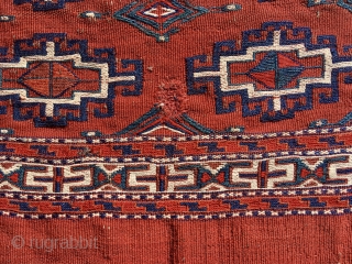 Yomut chuval, complete with red plainweave back. Flatweave with Memling-gul design in sumac and other weft-wrapping.  49” wide by 30” deep (125 cm x 76 cm).  Overall condition very good.  ...