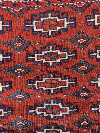 Yomut chuval, complete with red plainweave back. Flatweave with Memling-gul design in sumac and other weft-wrapping.  49” wide by 30” deep (125 cm x 76 cm).  Overall condition very good.  ...