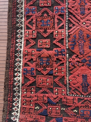 Baluch rug.  53” x 28” (135 cm x 72 cm)(Width varies). Very attractive little rug in good condition.  The surface appears embossed because the black is corrosive and worn shorter,  ...