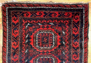  A attractive Baluch rug in excellent condition.   Size is typical for Baluch--67 inches x 35 inches (170 cm x 89 cm).  Turkmen design motifs—field with five Salor-like guls,  ...