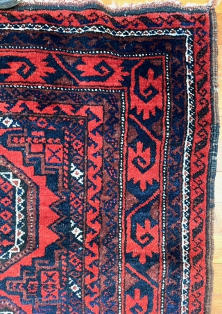  A attractive Baluch rug in excellent condition.   Size is typical for Baluch--67 inches x 35 inches (170 cm x 89 cm).  Turkmen design motifs—field with five Salor-like guls,  ...