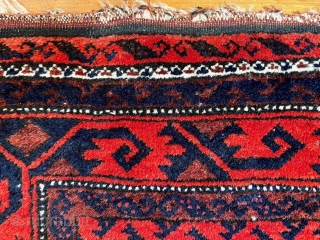  A attractive Baluch rug in excellent condition.   Size is typical for Baluch--67 inches x 35 inches (170 cm x 89 cm).  Turkmen design motifs—field with five Salor-like guls,  ...