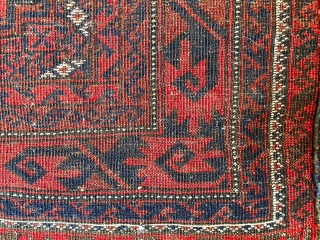  A attractive Baluch rug in excellent condition.   Size is typical for Baluch--67 inches x 35 inches (170 cm x 89 cm).  Turkmen design motifs—field with five Salor-like guls,  ...