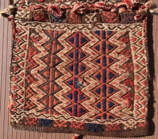 Turkish heybe or small double bag with a long slot in the bridge area to put the head through so it can be worn hanging over the shoulders with the bags front  ...