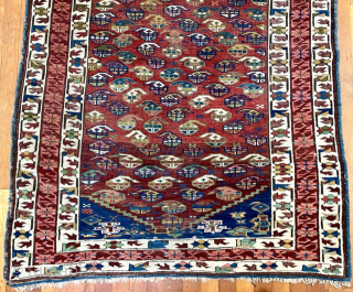 Antique Caucasian Kuba rug.  63 in. x 42 in. (160 cm x 107 cm).  The central border design and its dark red and coral colors are typical of Zeichur, as  ...