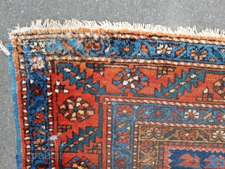 Karadja  -about 7'4" x 10'7".  Nice color and drawing.  Scattered wear throughout and slight mothing one corner (see picture) easily repaired.  Very decorative carpet and complete with original  ...