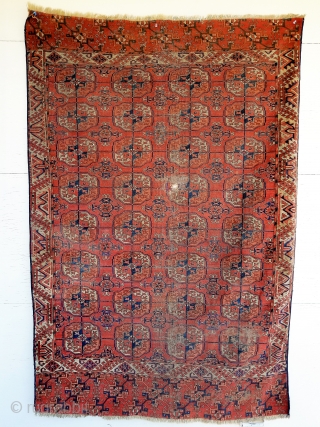 Tekke - as found condition. interesting border and skirt embellishments for its type. about 4'1" x 5'11" having wear, small patches, ends/sides not original         